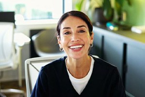 Friendly front desk team member in dental office