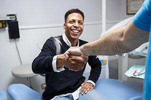 Older woman smiling at dentist