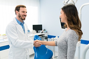 Man in dental chair relaxed and smiling