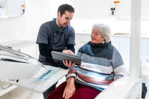 Senior patient consulting with her dentist