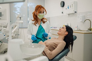 Dentist and patient engaged in friendly conversation