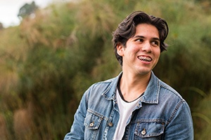 Smiling young man, happy he chose professional braces treatment