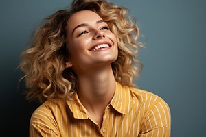 Portrait of smiling woman in yellow blouse