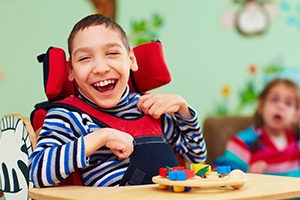 Laughing child in wheelchair