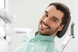 Man smiling after dental bonding treatment