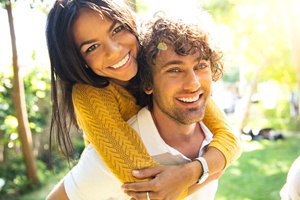 Young couple enjoying the benefits of dental bonding treatment