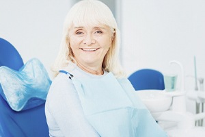 Senior dental patient enjoying the many benefits of dentures