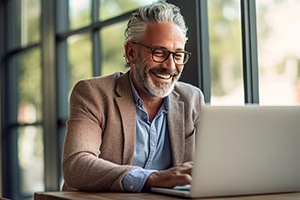 Mature businessman working on his computer