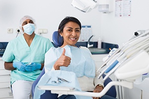 Happy woman attending appointment for preventive dental care