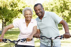 Healthy couple smiles outside after toothache treatment in East Hartford