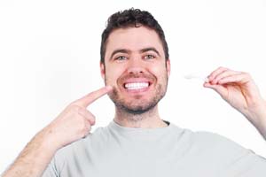 Happy man enjoying the benefits of Invisalign® treatment