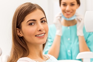 Patient in dental chair with bracket and wire braces