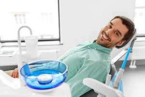 Man in dental chair for periodontal therapy