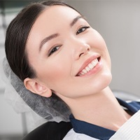 Woman smiling after scaling and root planing