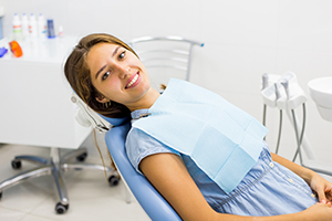 Woman smiling after oral cancer screening