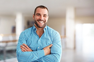 Portrait of smiling, happy man wearing blue checkered shirt