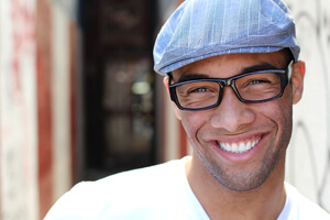 Man with straight teeth after using traditional braces