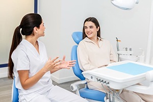 Dental team member and patient having a pleasant conversation