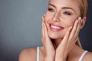 Woman showing off smile after porcelain veneers
