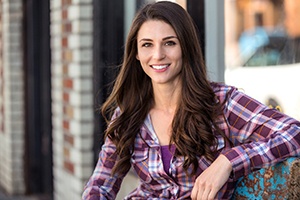 Smiling young woman enjoying her veneers in East Hartford