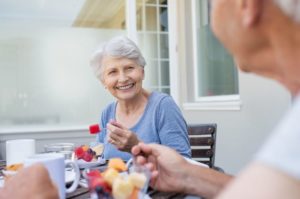 Senior couple eating, thinking about dentures and taste in East Hartford