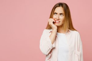 Woman biting her fingernails