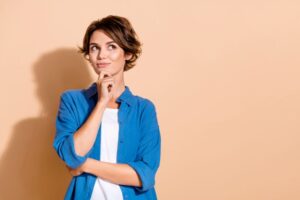 Woman wearing curious, thoughtful expression